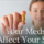 Woman holding up a pill